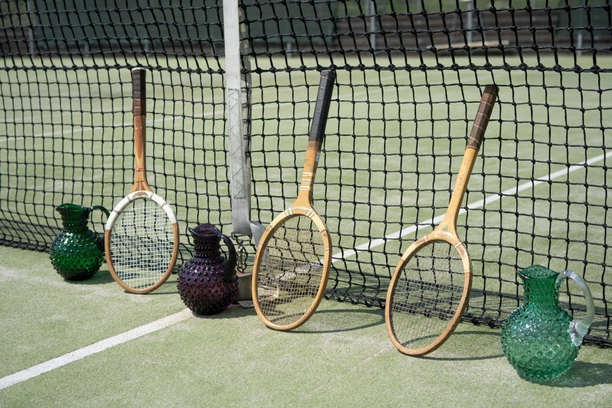 Underlay Dark Green Hobnail Jug on a tennis court with rackets and a net