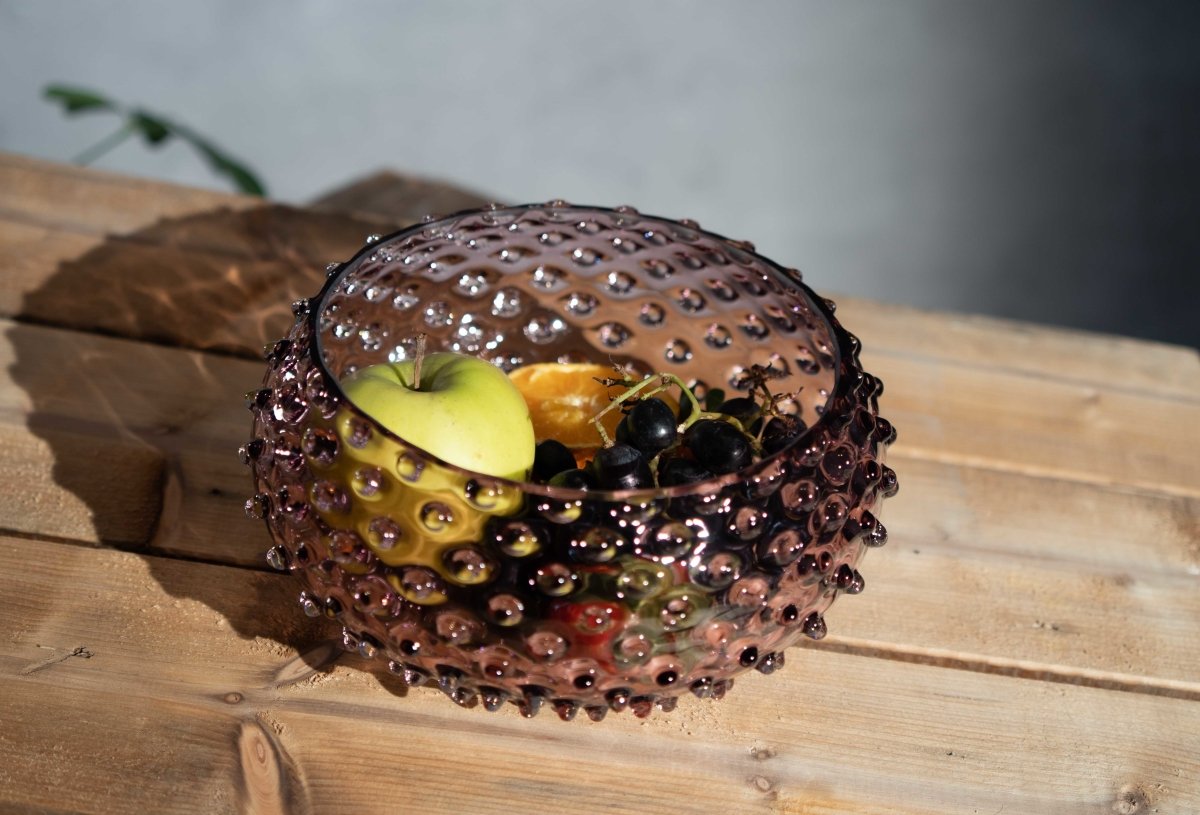 Underlay Violet Hobnail Bowl on a wooden table with various fruits