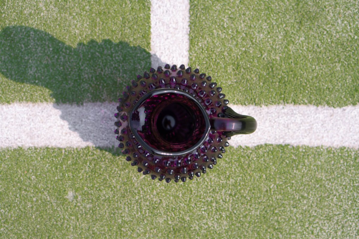 Violet Hobnail Jug on a tennis court
