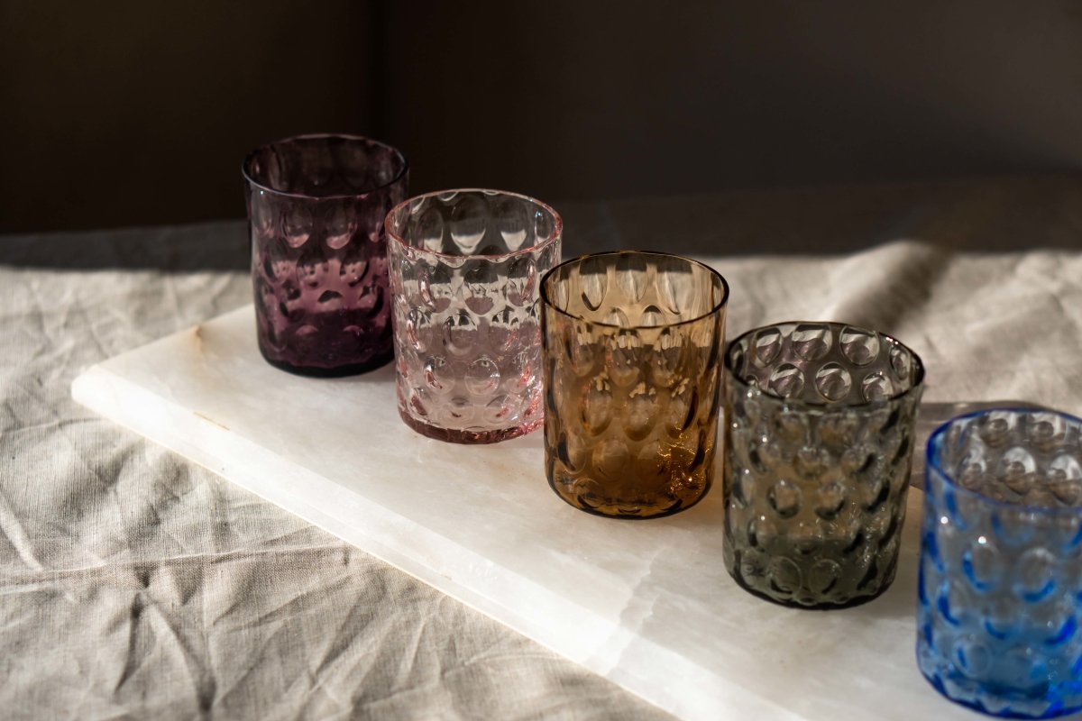 Violet Kugel Large Tumblers on a rectangular white marble room with shadows
