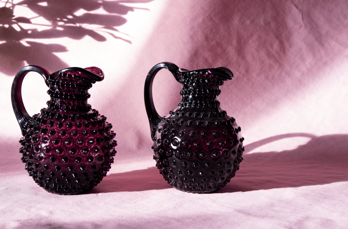 Violet Hobnail Jug on a pink fabric with shadows in the background