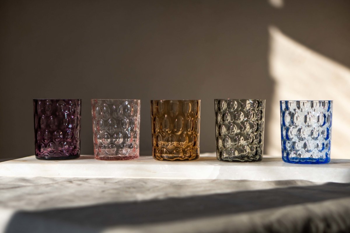 Violet Kugel Large Tumblers on a rectangular white marble room with shadows