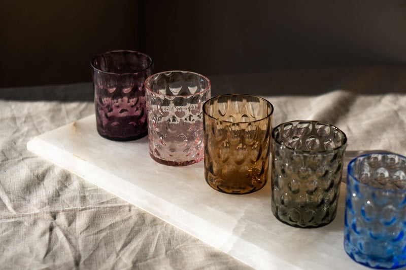 Violet Kugel Large Tumblers on a rectangular white marble room with shadows 